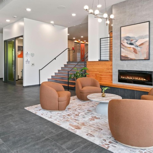 Access to resident-only features a room with a fireplace and chairs