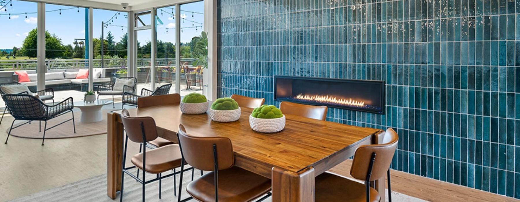 a dining room with a large blue wall