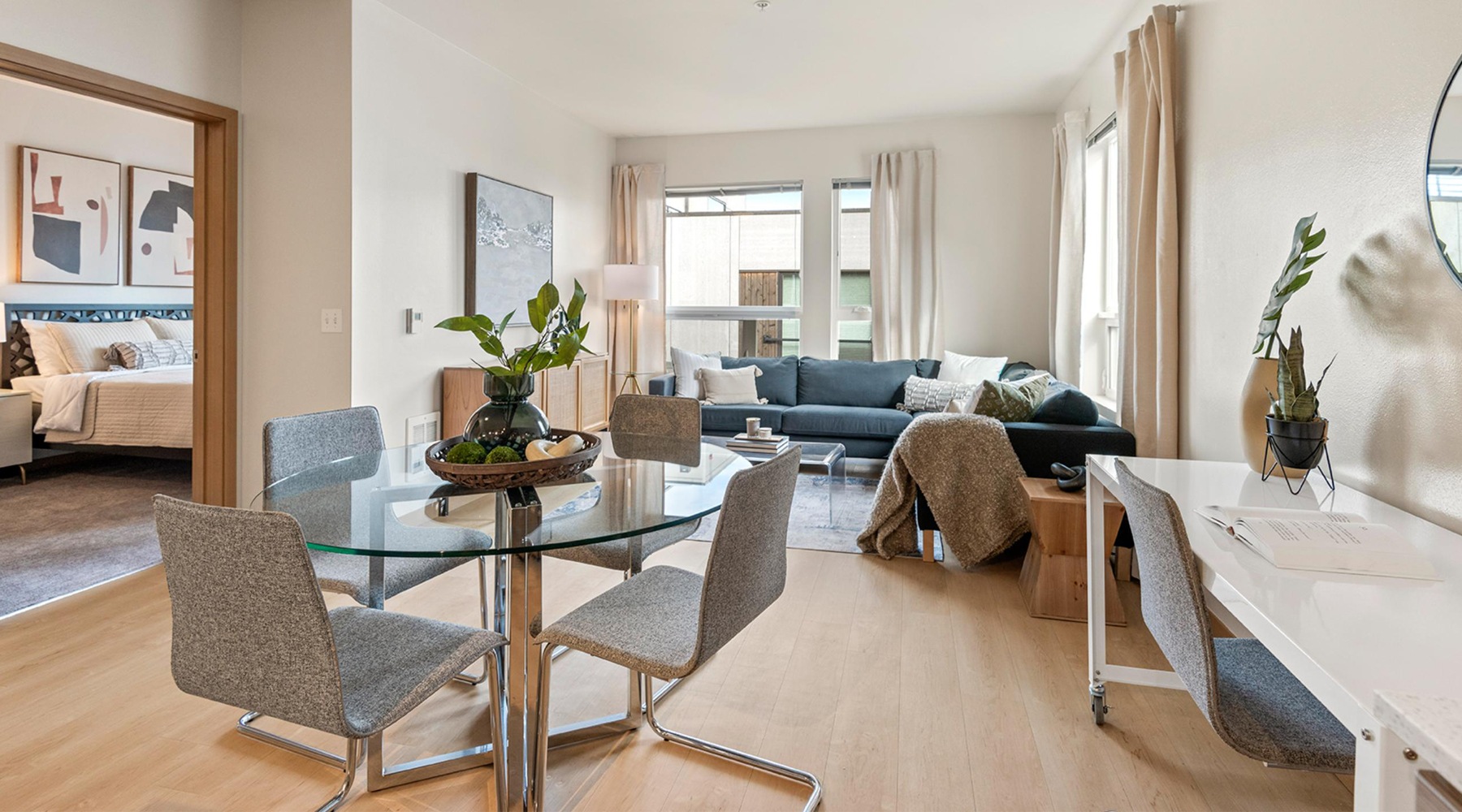 Modern, upscale living room and dining room at Slate Apartments in Seattle, WA