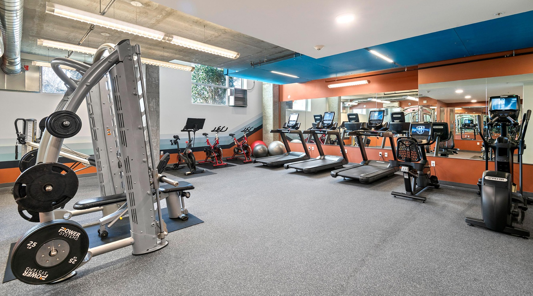 Gym with strength training and cardiovascular equipment at Slate, pet-friendly apartments in Seattle